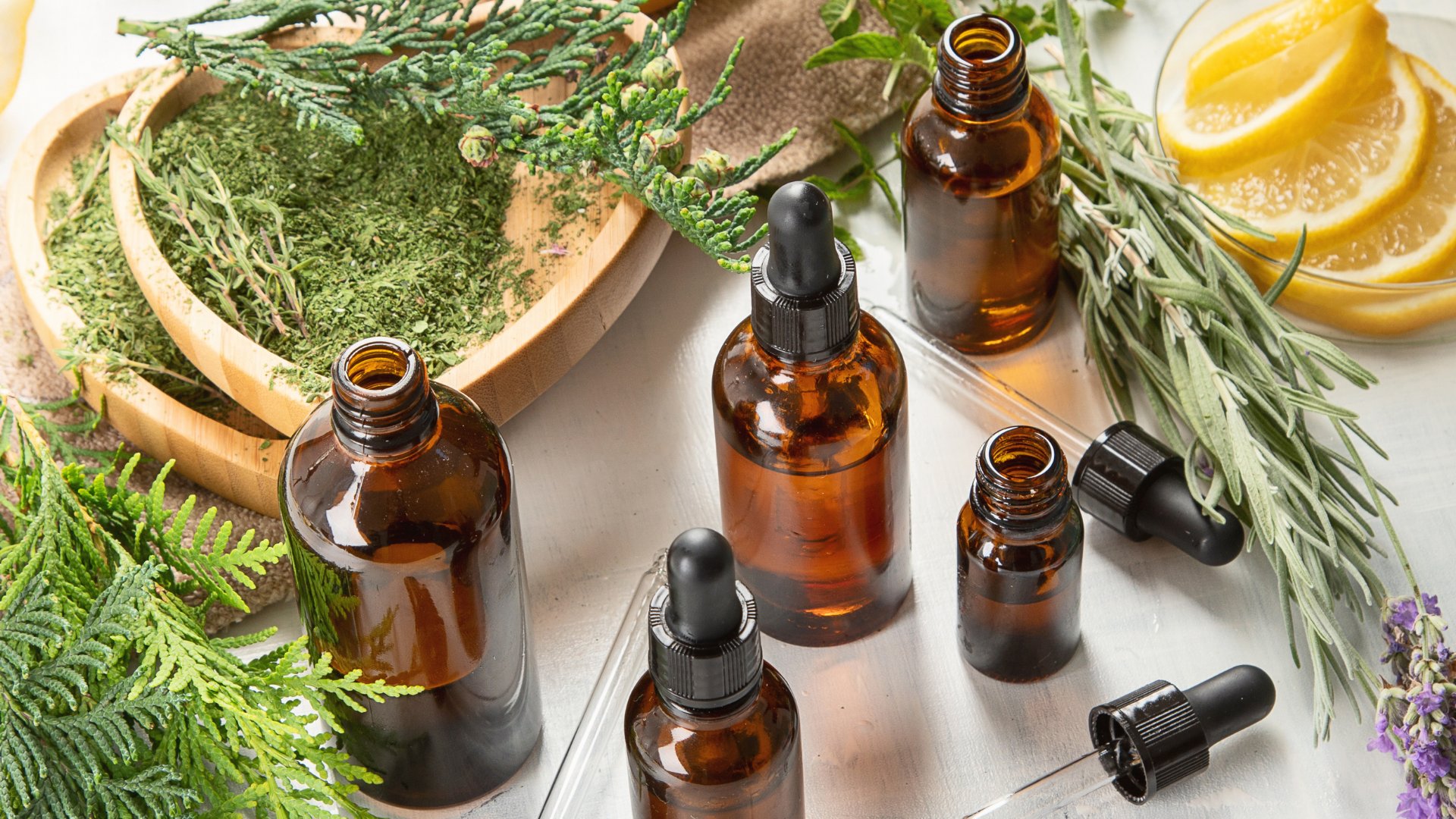 Cold-pressed botanical oils with fresh herbs and lemon